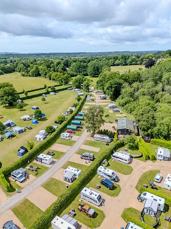 Touring caravan pitch at award-winning South Lytchett Manor site near Poole Dorset